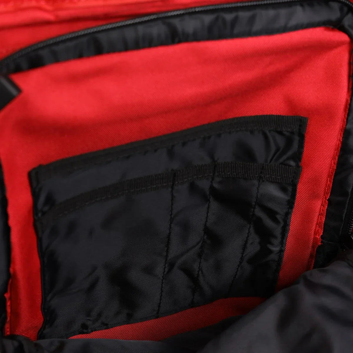 Mochila Gympack Pro 50 Litros Vermelha - Bolso Grande Frontal Aberto Mostrando Compartimento Interno