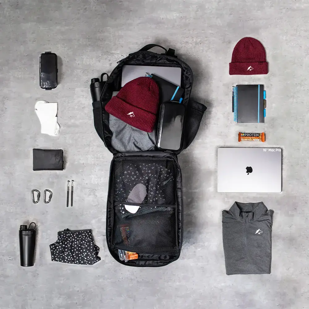 Mochila Gympack Pro 25L Preta - Vista Superior com Compartimentos Abertos e Itens Organizados